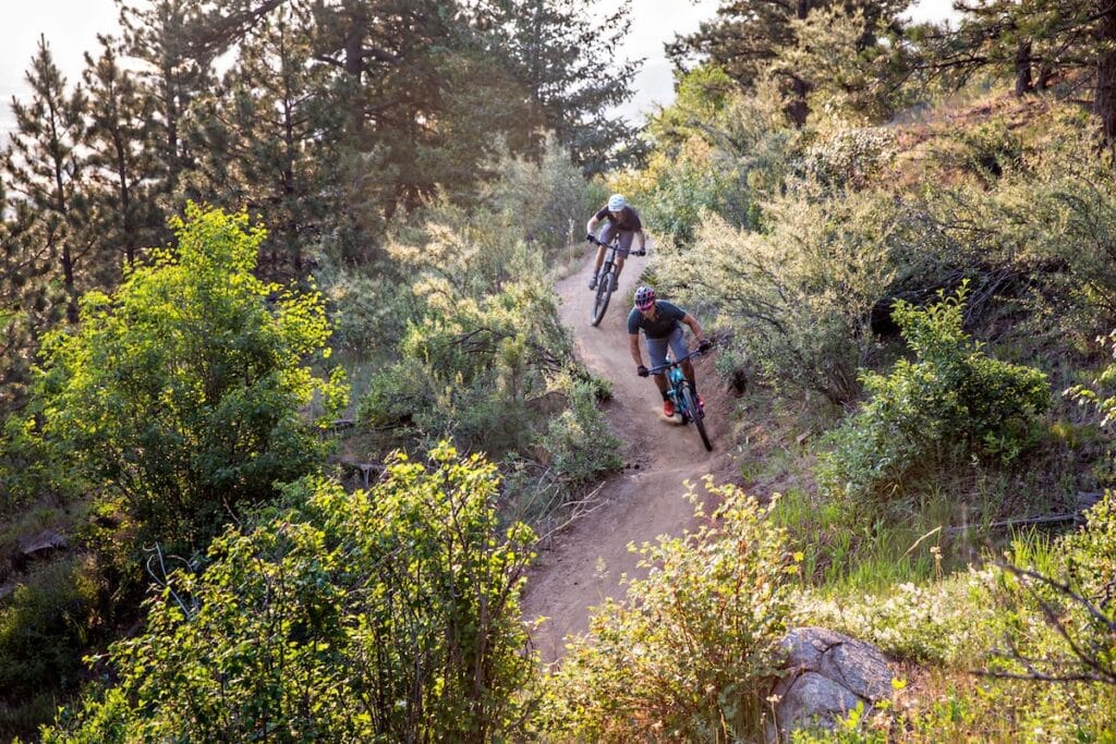 People riding demo bikes on trail