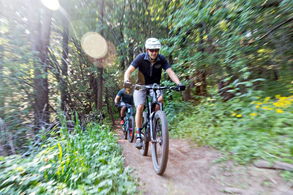 riding on the trail after scoring deals on mountain bikes