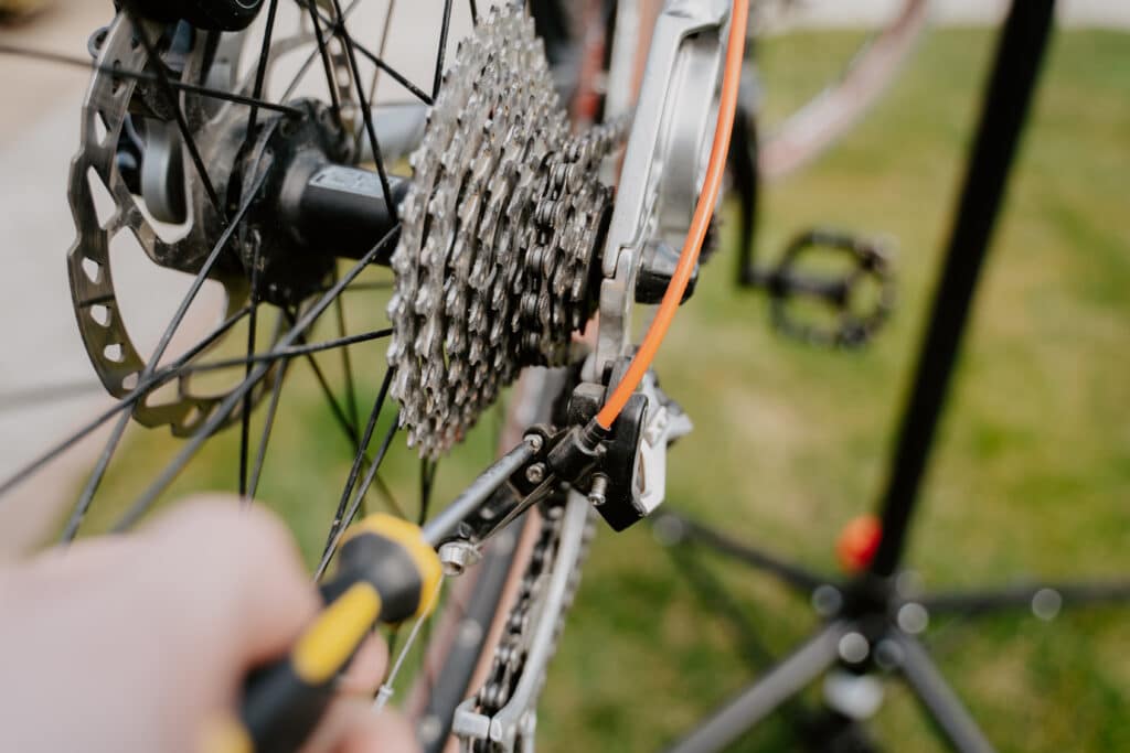 mechanic performing mountain bike service