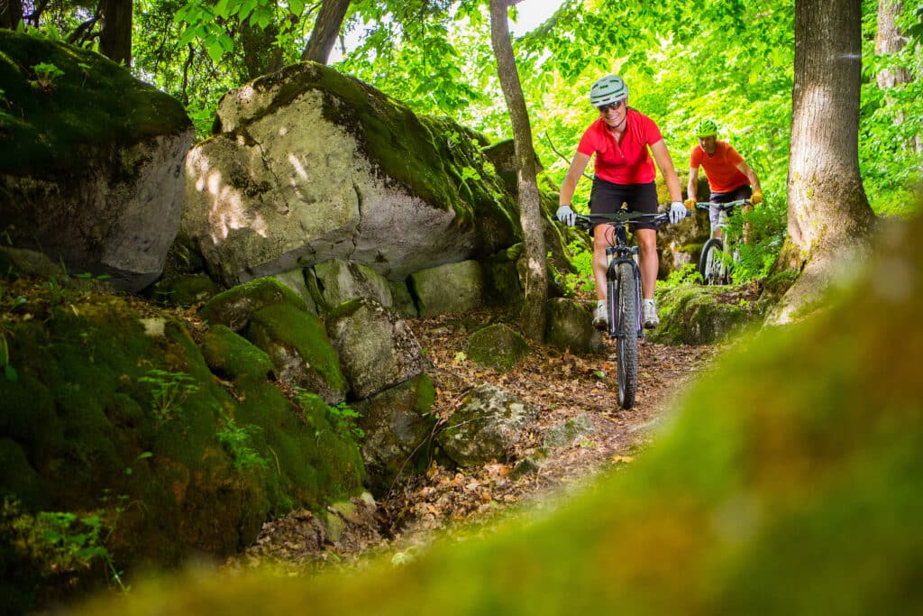 couple riding mountain bikes